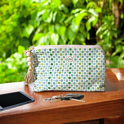 This adorable zipper close bag with green and blue dots is called a "Beauty Bag" but can be used as a small purse. Get your' today from Harvest Array.