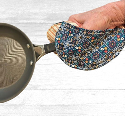 You won't burn your hands on the handle of a skillet with this blue squares with flowers patterned Handmade Heart Shaped Potholder with Hand Pockets from Harvest Array.