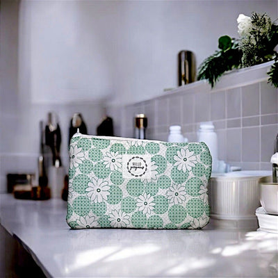 Green Daisy Print Cosmetic Bag with "Hello Gorgeous" Tag. Made in America for Harvest Array. 