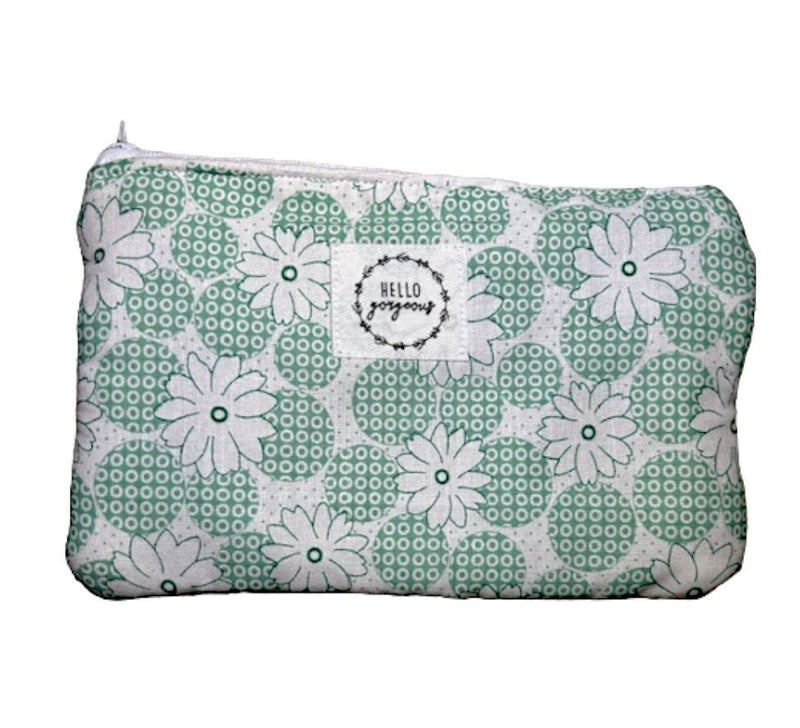 Handmade in Washington state, this pouch with a one-of-a-kind, green circles with white daisies pattern is approximately 9"x6".