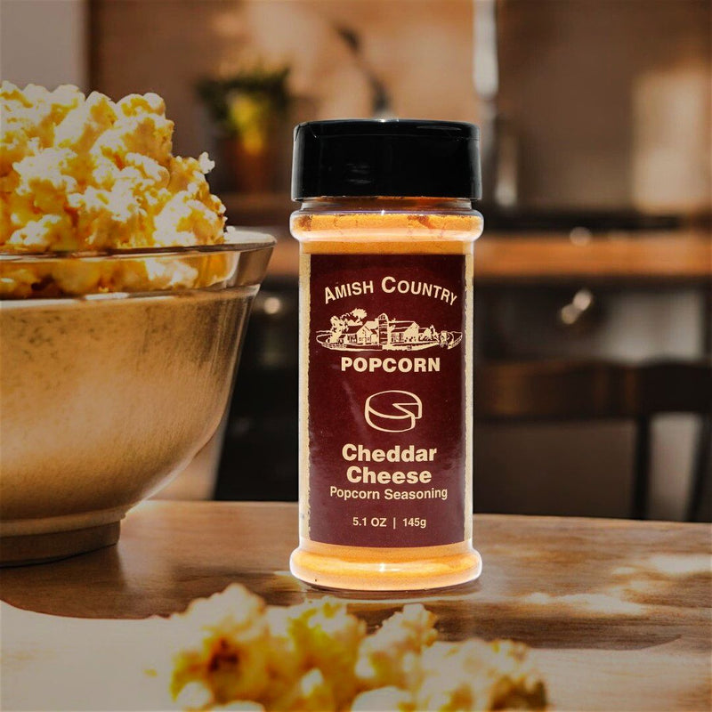 Liven up your plain popcorn with a dash of Amish Country Cheddar Cheese Popcorn Seasoning from Harvest Array. Kids love it.