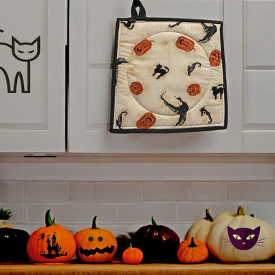 Our Jack-O-Lantern Kitty Potholder will look great hanging in your kitchen amongst other spooky Halloween decor. It's Reversible too. 