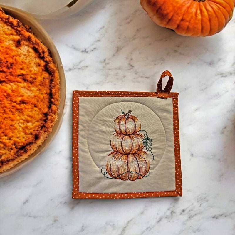 Decorate the kitchen for Fall with this pretty "Pumpkin Stack" Embroidered Reversible Hot Pad/Potholer. Quantities are Limited. Order today at hrvestarray.com.