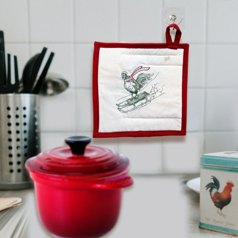 Shop Harvest Array for fun and unique Winter themed Potholders like this sledding chicken! Handmade in America.