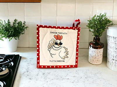 Add humor to your kitchen with our handmade potholders like this one - a sassy chicken, "Sunshine mixed with a little Hurricane!"