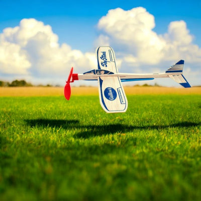 Guillow's Sky Streak Balsa Plane Over A Field