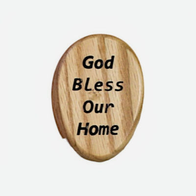 Close up of Natural Wood "God Bless Our House" Wooden Marble Towel Holder. A marble holds the towel in place. 