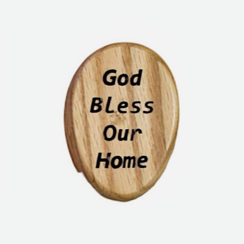 Close up of Natural Wood "God Bless Our House" Wooden Marble Towel Holder. A marble holds the towel in place. 